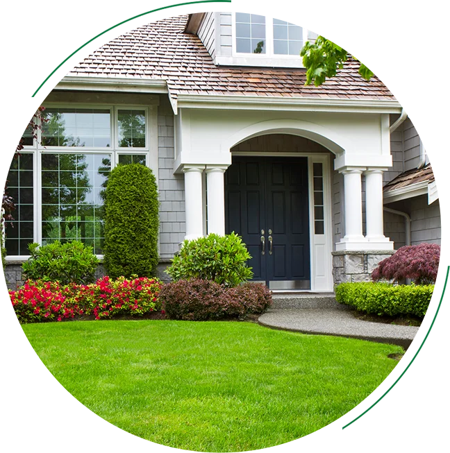 Green lawn with house and front door.
